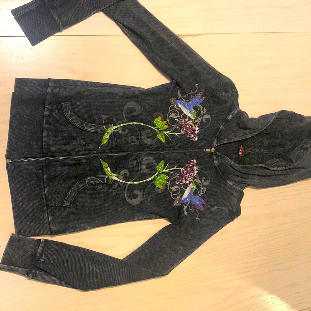 Sexy thermal hoody material stonewashed black has detailing of rhinestone.